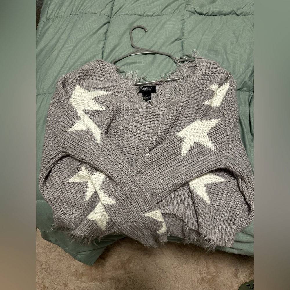 Purple sweater with white stars